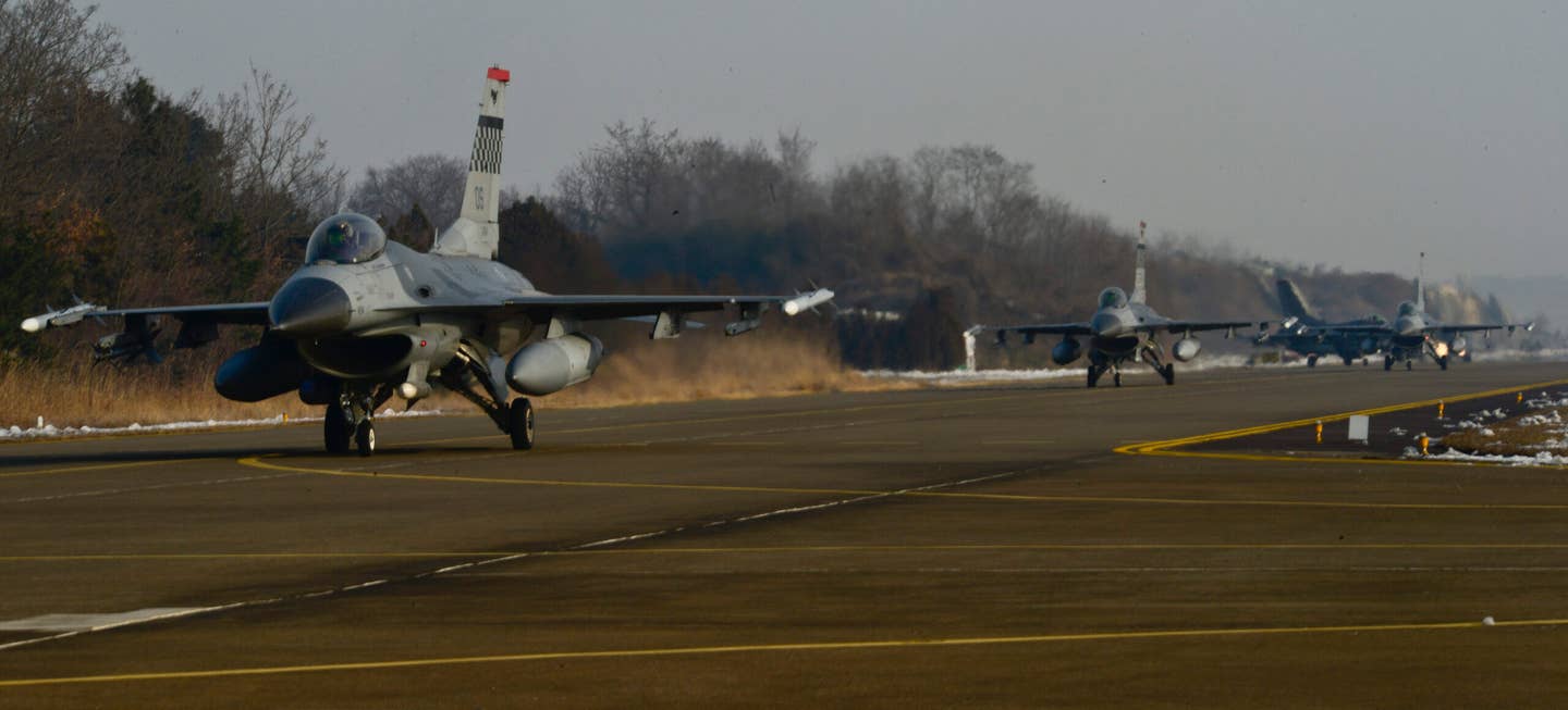 F-16s from the 36th Fighter Squadron, U.S. Air Force, taxi to the runway prior to takeoff during the Buddy Wing 16-1 drill at Seosan Air Base, South Korea, in 2016. Exercises like these provide an opportunity for the U.S. and South Korean forces to train together for real-world contingencies. <em>U.S. Air Force photo by Senior Airman Kristin High/Released</em>