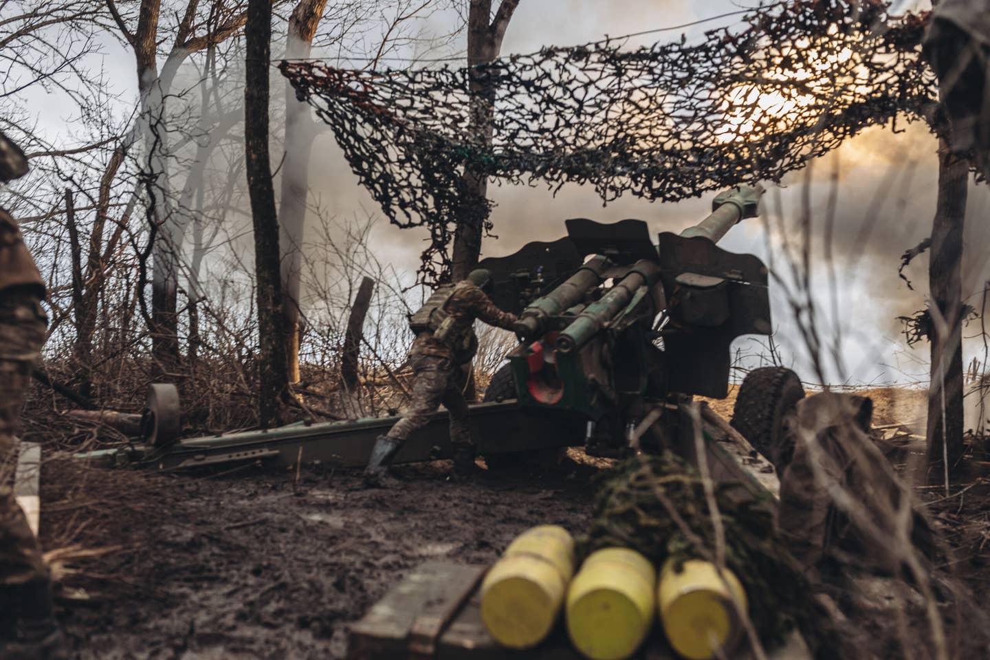 Ukrainian soldiers fire artillery on the Donbas frontline. The OF-25T munitions can be seen in the foreground.<em> Photo by Diego Herrera Carcedo/Anadolu Agency via Getty Images</em>