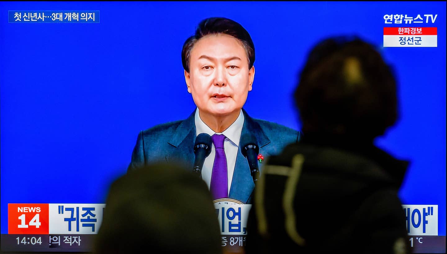 South Korean President Yoon Suk Yeol provides a New Year’s address to the South Korean people, on January 1, as seen during a news program at the Yongsan Railway Station in Seoul. <em>Photo by Kim Jae-Hwan/SOPA Images/LightRocket via Getty Images</em>