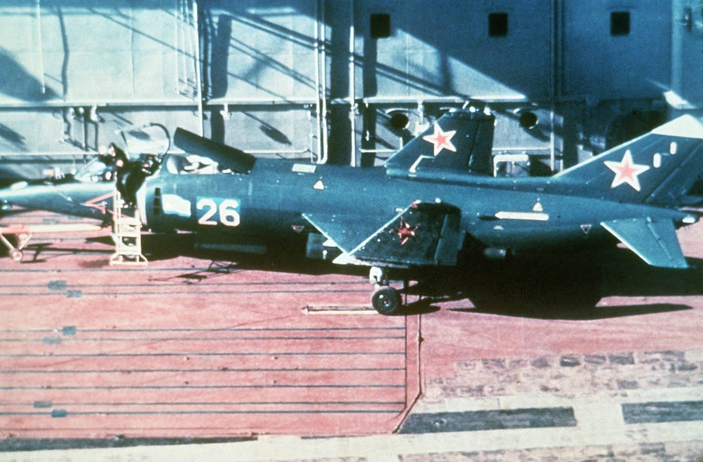 A Yak-38 Forger VTOL fighter jet parked aboard the flight deck of the Soviet aircraft carrier <em>Kiev</em>. <em>U.S. Department of Defense</em>