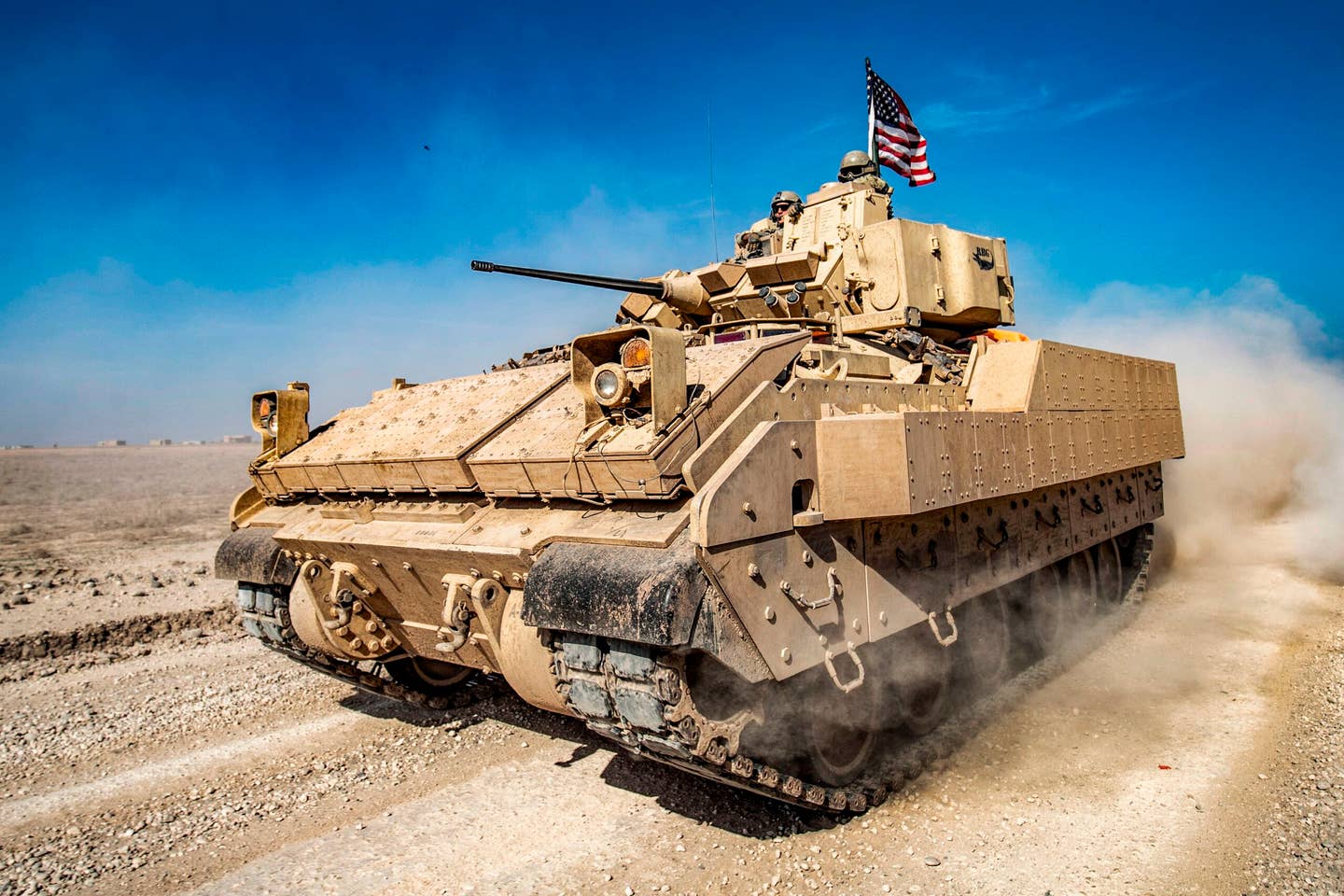 A U.S. Army Bradley Fighting Vehicle (BFV) patrols in the Suwaydiyah oil fields in Syria's northeastern Hasakah province on Feb. 13, 2021. (Photo by Delil SOULEIMAN / AFP) (Photo by DELIL SOULEIMAN/AFP via Getty Images)