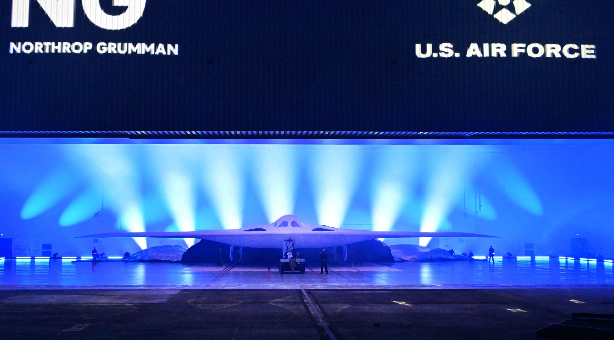 The new B-21 Raider is unveilled during a ceremony at Northrop Grumman's Air Force Plant 42 in Palmdale, California, December 2, 2022. - The high-tech stealth bomber can carry nuclear and conventional weapons and is designed to be able to fly without a crew on board. The B-21 -- which is on track to cost nearly $700 million per plane and is the first new US bomber in decades -- will gradually replace the B-1 and B-2 aircraft, which first flew during the Cold War. (Photo by Frederic J. BROWN / AFP) (Photo by FREDERIC J. BROWN/AFP via Getty Images)