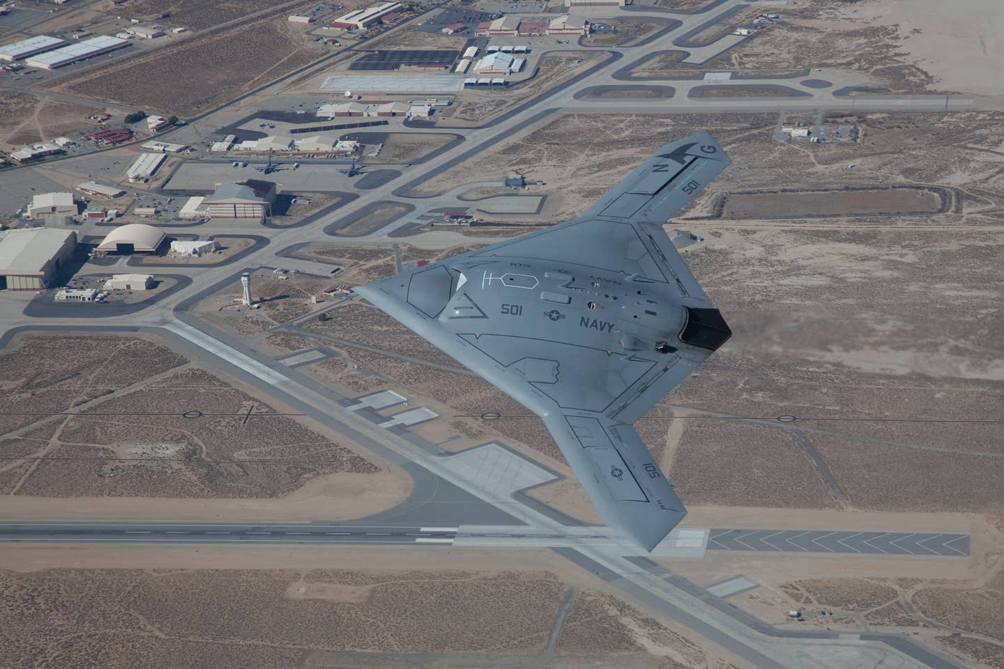 The X-47B conducts a test flight at Edwards Air Force Base, California in October 2011. <em>U.S. Air Force photo </em>b<em>y Chris A. Neill</em>