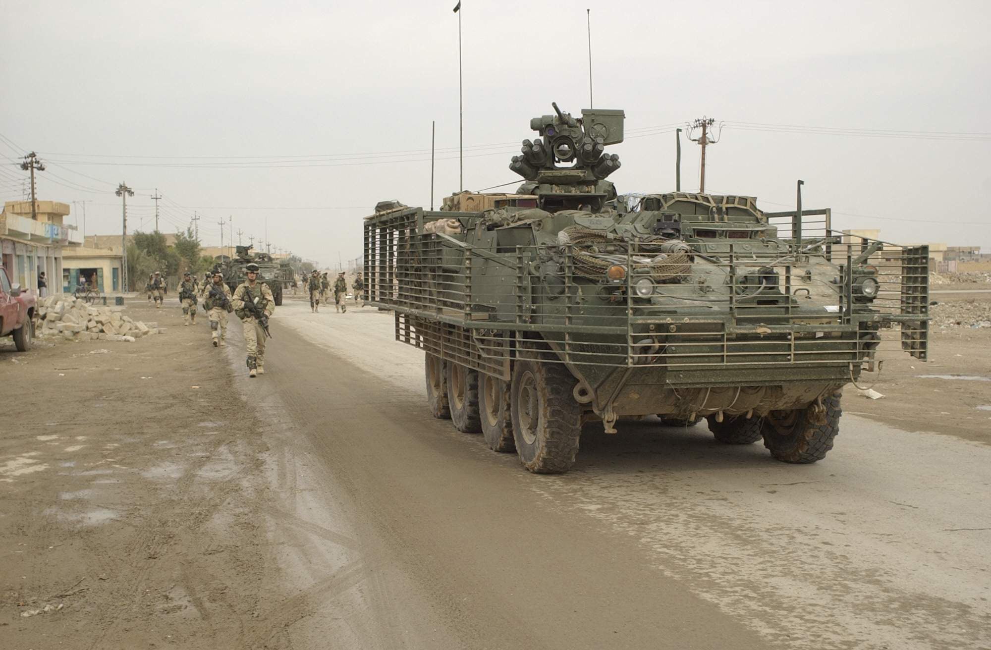 Soldiers of Battle Company, 5th Battalion - 20 Infantry, 3rd Brigade, 2nd Infantry Division (Stryker Brigade Combat Team) conduct route reconnaissance, a presence patrol, a civilian assessment, and combat operations contributing to the stability of Samarra, Iraq on December 15, 2003.  The 3rd Brigade, 2nd Infantry Division (Stryker Brigade Combat Team) is under the operational control of the 4th Infantry Division.  (U.S. Army photo by Spc. Clinton Tarzia) (Released)