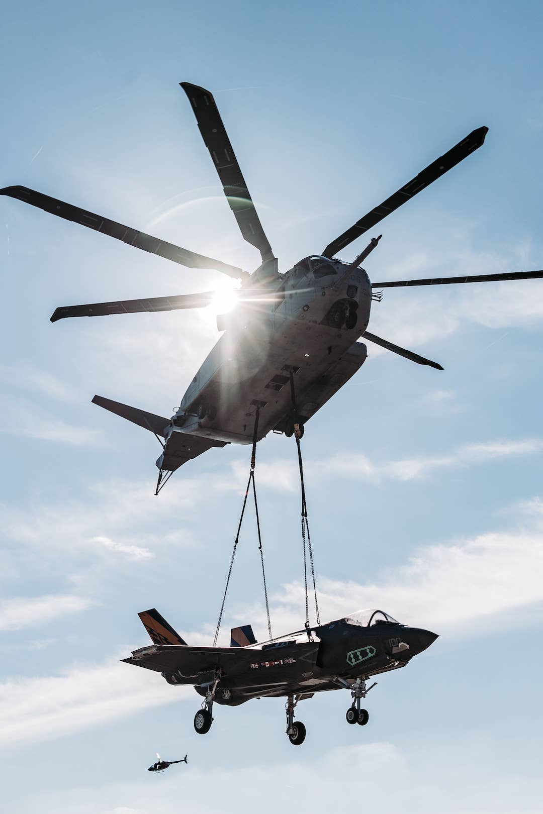 A CH-53K King Stallion with Marine Operational Test and Evaluation Squadron one (VMX-1), lifts an F-35C Lightning II during Helicopter Support Team operations. <em>U.S. Marine Corps photo by Cpl. Meshaq Hylton</em>