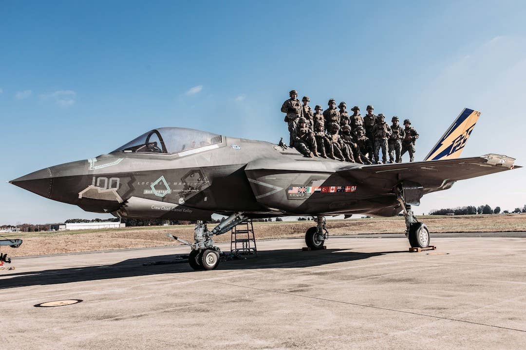 U.S. Marines with Combat Logistics Battalion (CLB) 24, Combat Logistics Regiment 2, 2nd Marine Logistics Group, pose for a photo with F-35C CF-01 after completing Helicopter Support Team operations at Naval Air Station Patuxent River, Dec. 13, 2022. <em>U.S. Marine Corps photo by Cpl. Meshaq Hylton</em>