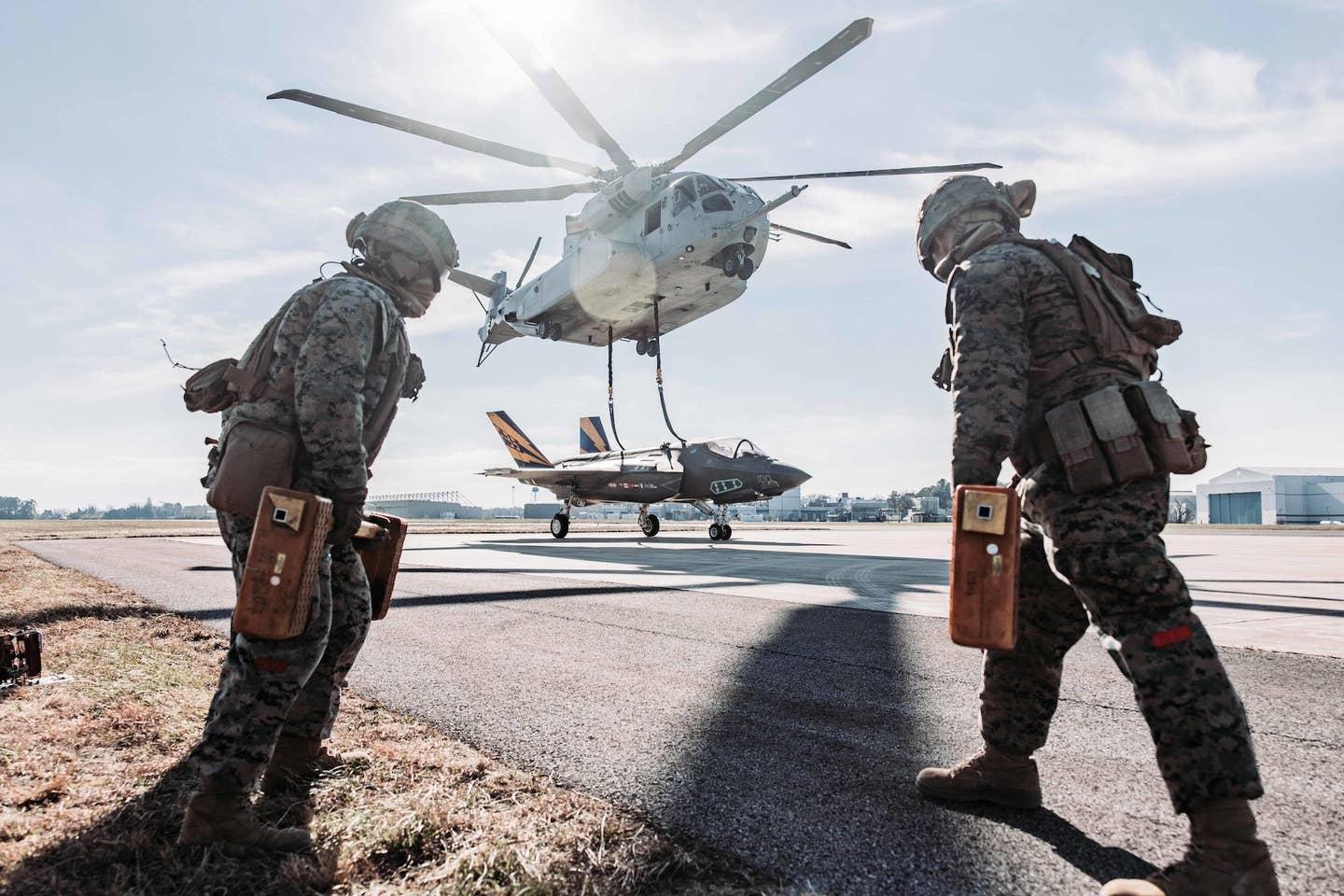 U.S. Marines with Combat Logistics Battalion (CLB) 24, Combat Logistics Regiment 2, 2nd Marine Logistics Group, wait for an F-35C Lightning II lift to land during Helicopter Support Team operations at Naval Air Station Patuxent River, Md., Dec. 13, 2022. <em>U.S. Marine Corps photo by Cpl. Meshaq Hylton</em>
