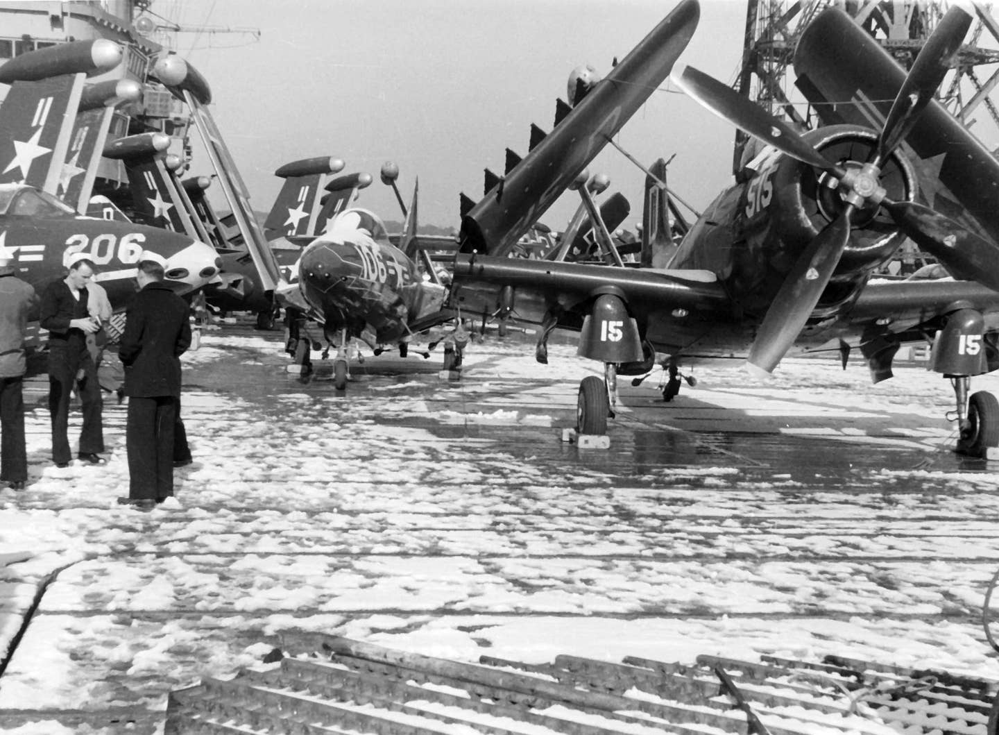 F9F-5&nbsp;Panthers of VF-121 and VF-122, and AD-3&nbsp;Skyraiders of Attack Squadron 125 (VA-125) on the snow-covered deck of the aircraft carrier USS&nbsp;<em>Oriskany</em> in Japanese waters. This was during the Korean deployment from September 1952 to May 1953. <em>U.S. Navy National Museum of Naval Aviation</em>