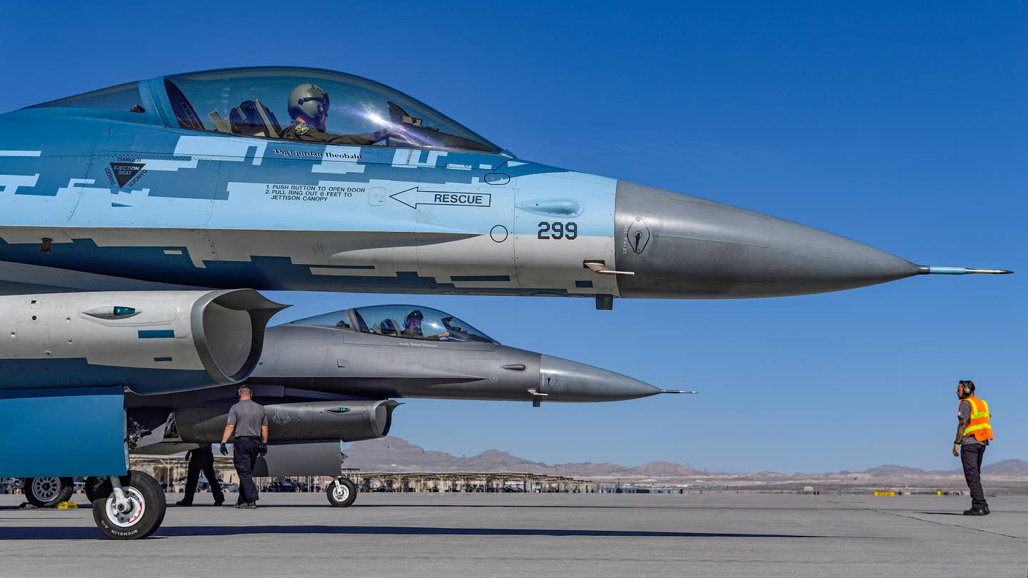 Aggressor F-16s prepare to depart from Nellis AFB. <em>Jamie Hunter</em>