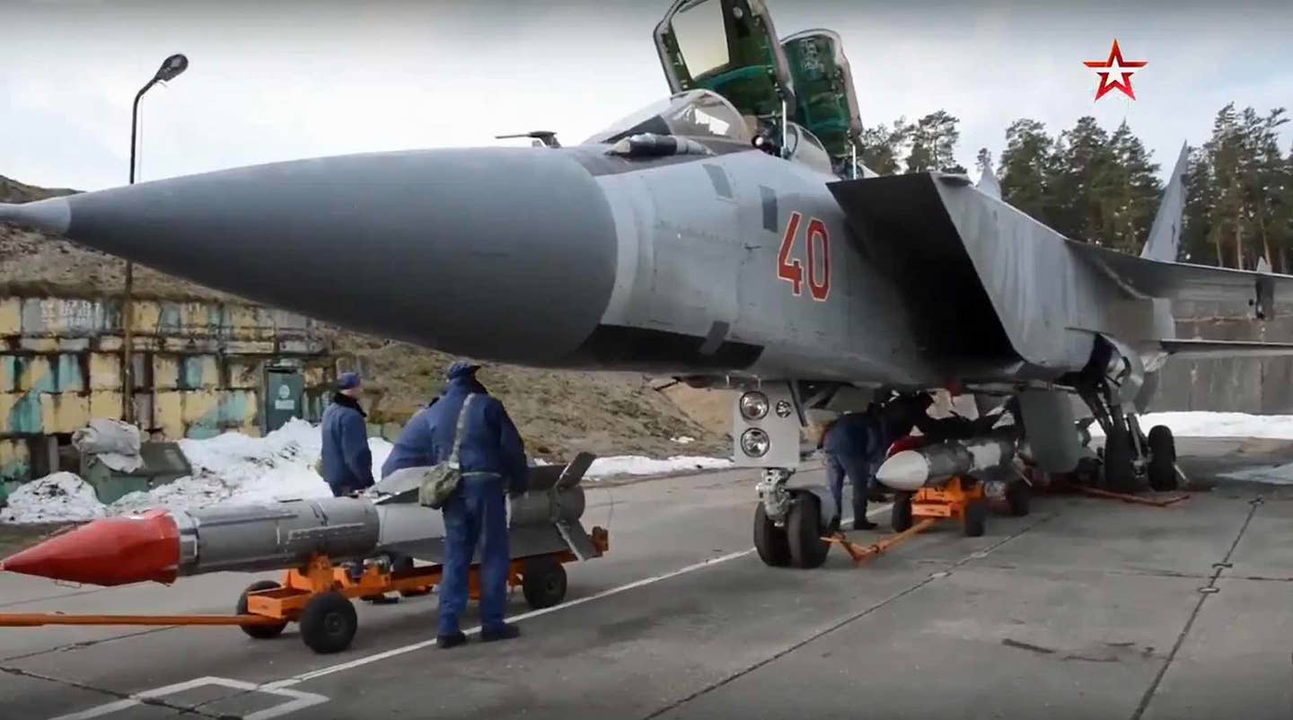 A MiG-31BM is loaded with R-33 air-to-air missiles. <em>Zvezda TV</em>
