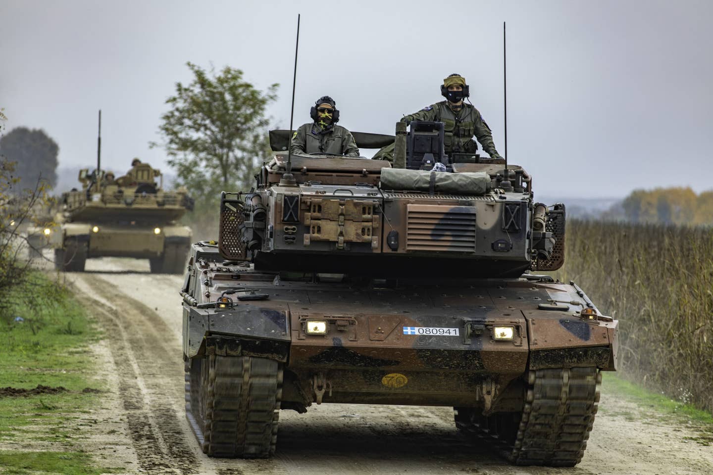 Hellenic Army soldiers lead the way in a Leopard 2 tank as a U.S. Army M1 Abrams tank follows behind as part of Exercise Olympic Cooperation 2021 in Xanthi, Greece. <em>U.S. Army/Cpl. Max Elliott</em><a href="https://api.army.mil/e2/c/images/2021/11/23/62ea5333/original.jpg" target="_blank" rel="noreferrer noopener"></a>