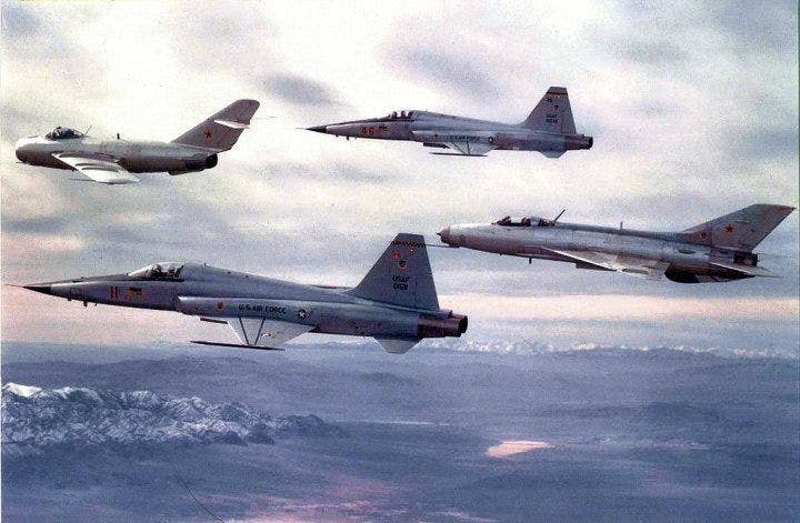 64th Aggressor Squadron F-5Es flank a MiG-21 and MiG-17 from the the 4477th. <em>USAF photo </em>