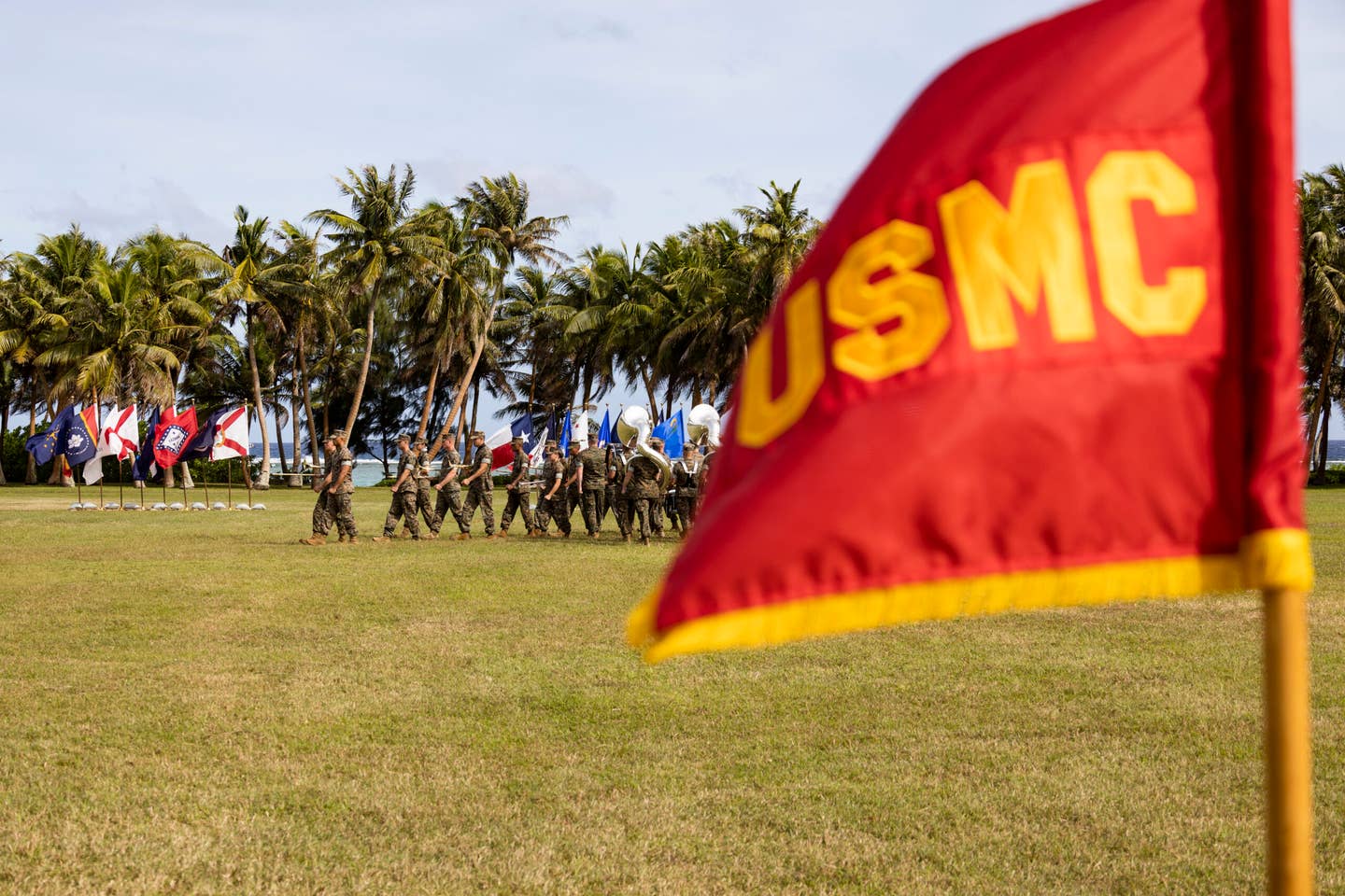 U.S. Marines with Marine Forces Pacific Band march during the Marine Corps Base Camp Blaz Activation and Naming Ceremony at Asan Beach, National Historical Park, Asan, Guam, on Jan. 26, 2023. <em>Credit: U.S. Marine Corps photo by Lance Cpl. Jonathan Beauchamp</em>