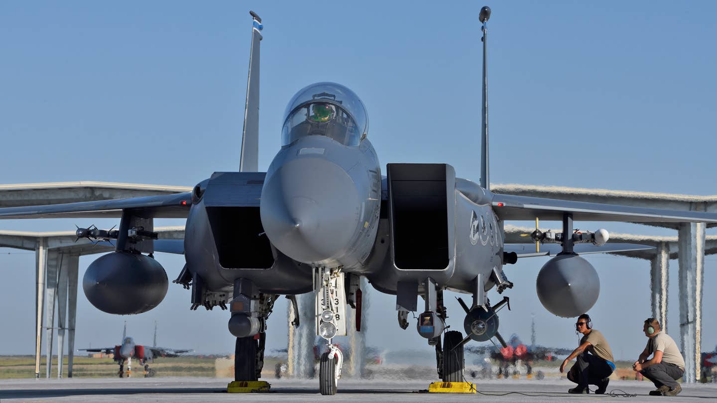 An F-15E of the 492nd Fighter Squadron with its traditional CFTs on the sides of the intakes. <em>Jamie Hunter</em>