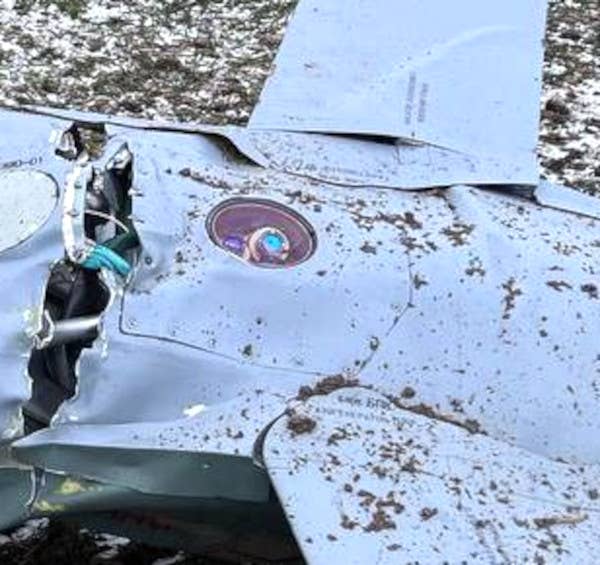 A close-up of the circular window on the underside of the missile's fuselage between its pop-out wings with what appears to be a camera behind it. <em>Ukrainian Air Force</em>