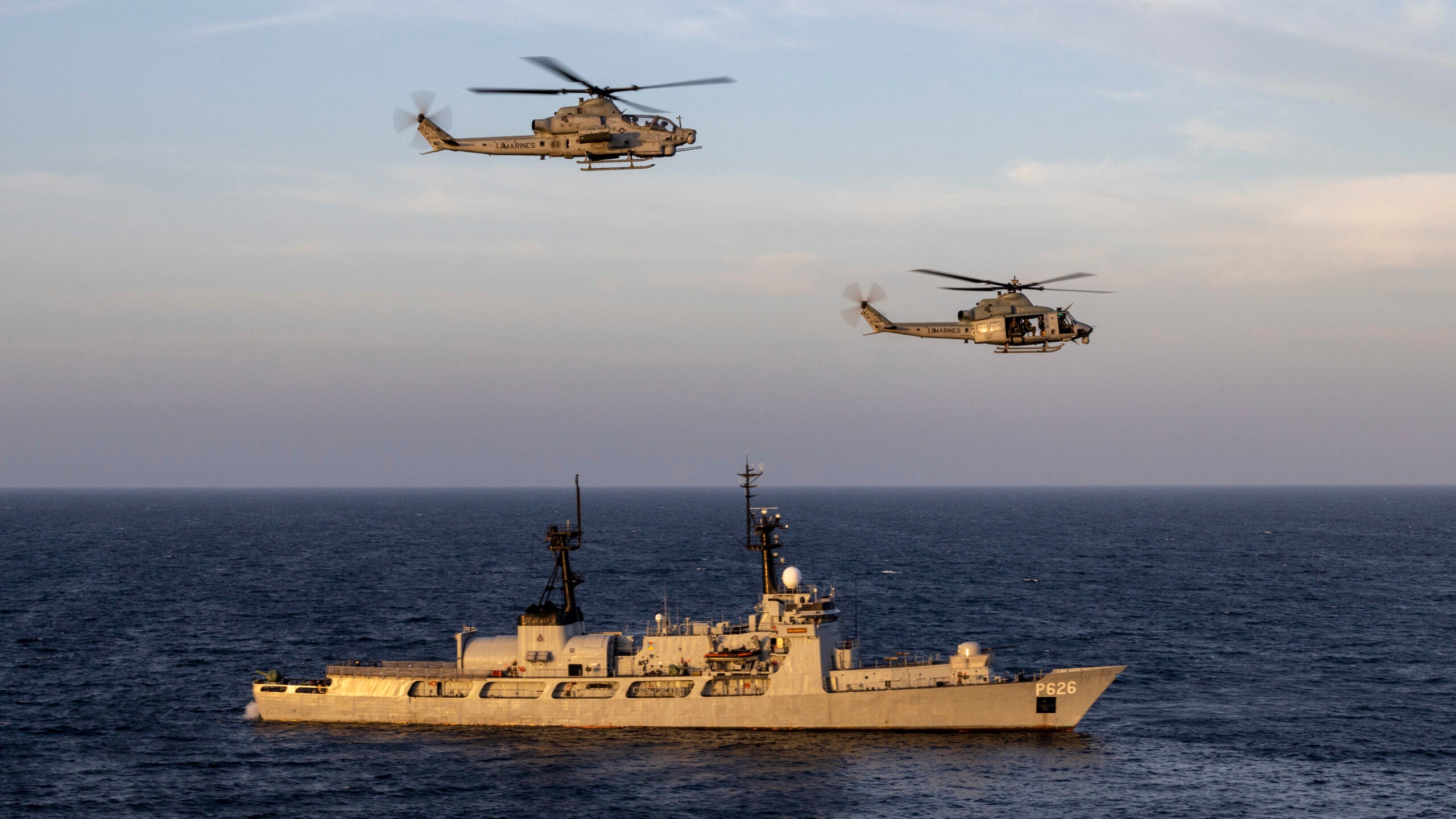 GULF OF MANNAR (Jan. 24, 2023) – U.S. Marine Corps UH-1Y Venom and AH-1Z Viper pilots with Marine Medium Tiltrotor Squadron (VMM) 362 (Rein.), 13th Marine Expeditionary Unit, fly next to Sri Lankan Naval Ship Gajabahu (P626), Jan. 24. The 13th MEU is embarked on the Makin Island Amphibious Ready Group, comprised of amphibious assault ship USS Makin Island (LHD 8) and amphibious transport dock ships USS John P. Murtha (LPD 26) and the Anchorage, and operating in the U.S. 7th Fleet area of operations to enhance interoperability with Allies and partners and serve as a ready-response force to defend peace and maintain stability in the Indo-Pacific region. (U.S. Marine Corps photo by Sgt. Kevin G. Rivas)