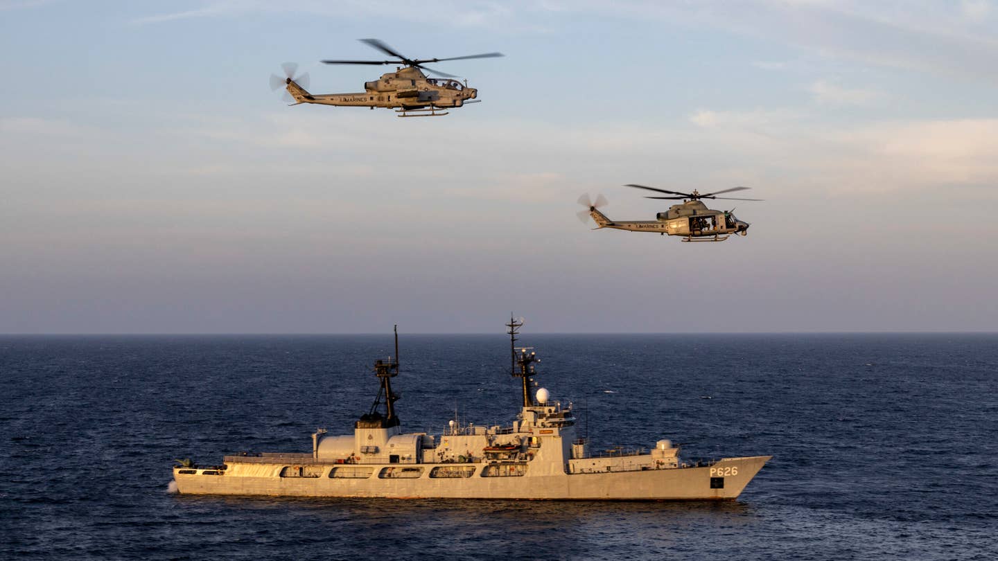 Marine Corps UH-1Y Venom and AH-1Z Viper helicopters fly next to Sri Lankan Naval Ship Gajabahu in January, 2023. <em>U.S. Marine Corps photo by Sgt. Kevin G. Rivas</em>