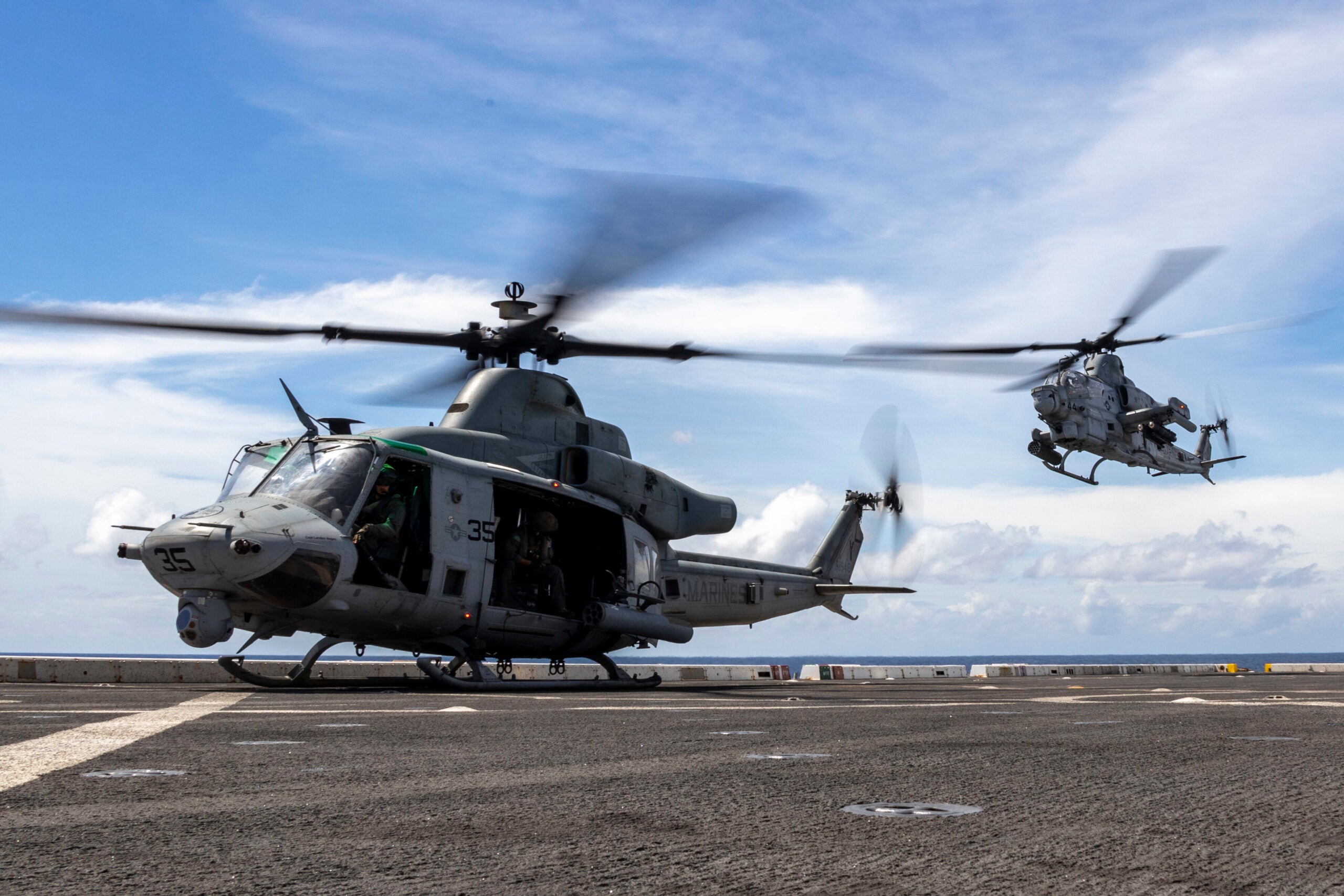 INDIAN OCEAN (Jan. 29, 2023) – U.S. Marine Corps UH-1Y Venom and AH-1Z Viper pilots with Marine Medium Tiltrotor Squadron (VMM) 362 (Rein.), 13th Marine Expeditionary Unit, take off from the amphibious transport dock USS Anchorage (LPD 23) to conduct hoist training, Jan. 29. The 13th MEU is embarked on the Makin Island Amphibious Ready Group, comprised of amphibious assault ship USS Makin Island (LHD 8) and amphibious transport dock ships USS John P. Murtha (LPD 26) and the Anchorage, and operating in the U.S. 7th Fleet area of operations. 7th Fleet is the U.S. Navy’s largest forward-deployed numbered fleet, and routinely interacts and operates with Allies and partners in preserving a free and open Indo-Pacific region. (U.S. Marine Corps photo by Cpl. Austin Gillam)