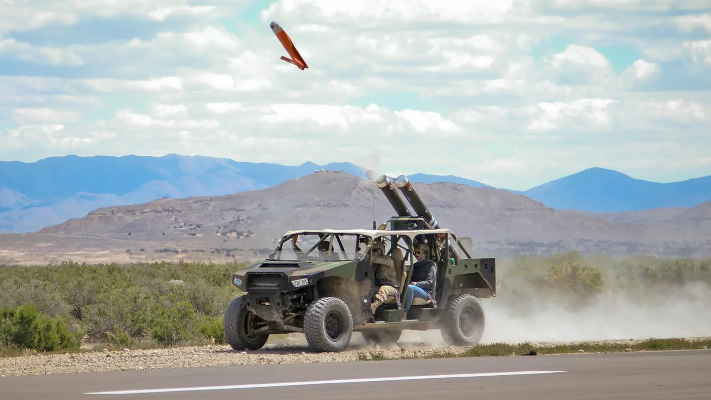 A light vehicle fitted with a pair of Pneumatically Integrated Launch Systems (PILS) launches an ALTIUS-600 as part of a U.S. Army test. <em>U.S. Army</em>