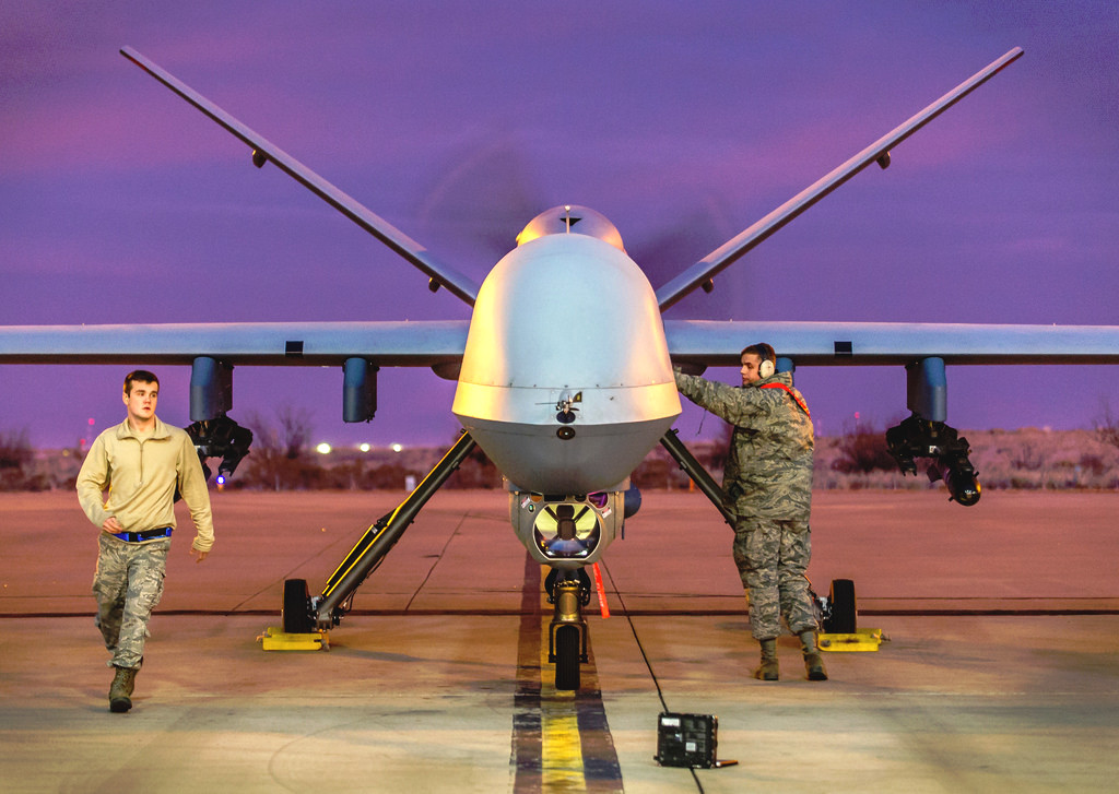 Airmen at Kandahar Airfield in Afghanistan ready an MQ-9 for a mission in 2017. Credit: <em>U.S. Air Force</em>