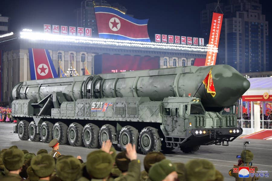 The newly revealed ICBM, apparently a solid-fuel type, on its nine-axle TEL vehicle. <em>KCNA</em>