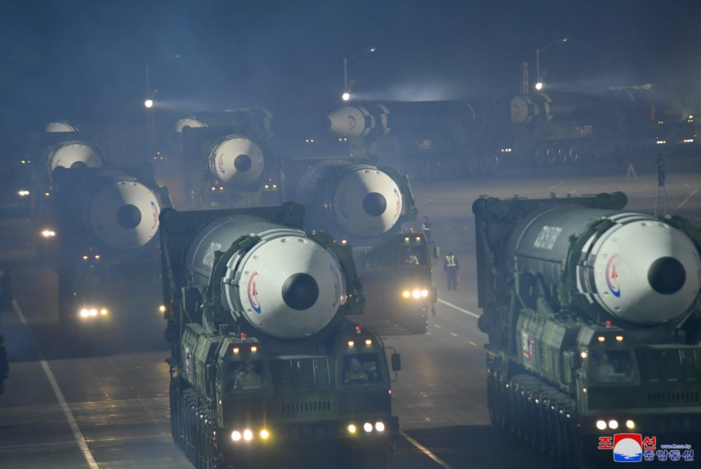 Multiple examples of the Hwasong-17 ICBM roll through Pyongyang. At least 10 are visible here. <em>KCNA</em>