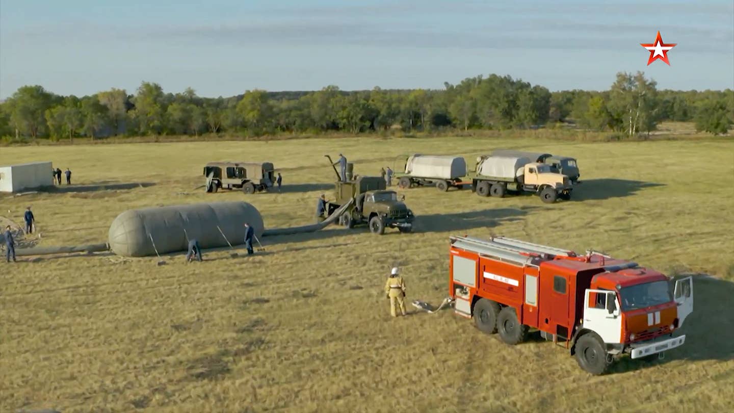 Ground equipment supporting the launch of an AN-S1 free balloon at the center in Volsk. The red fire truck is always ready. <em>TV Zvezda</em>
