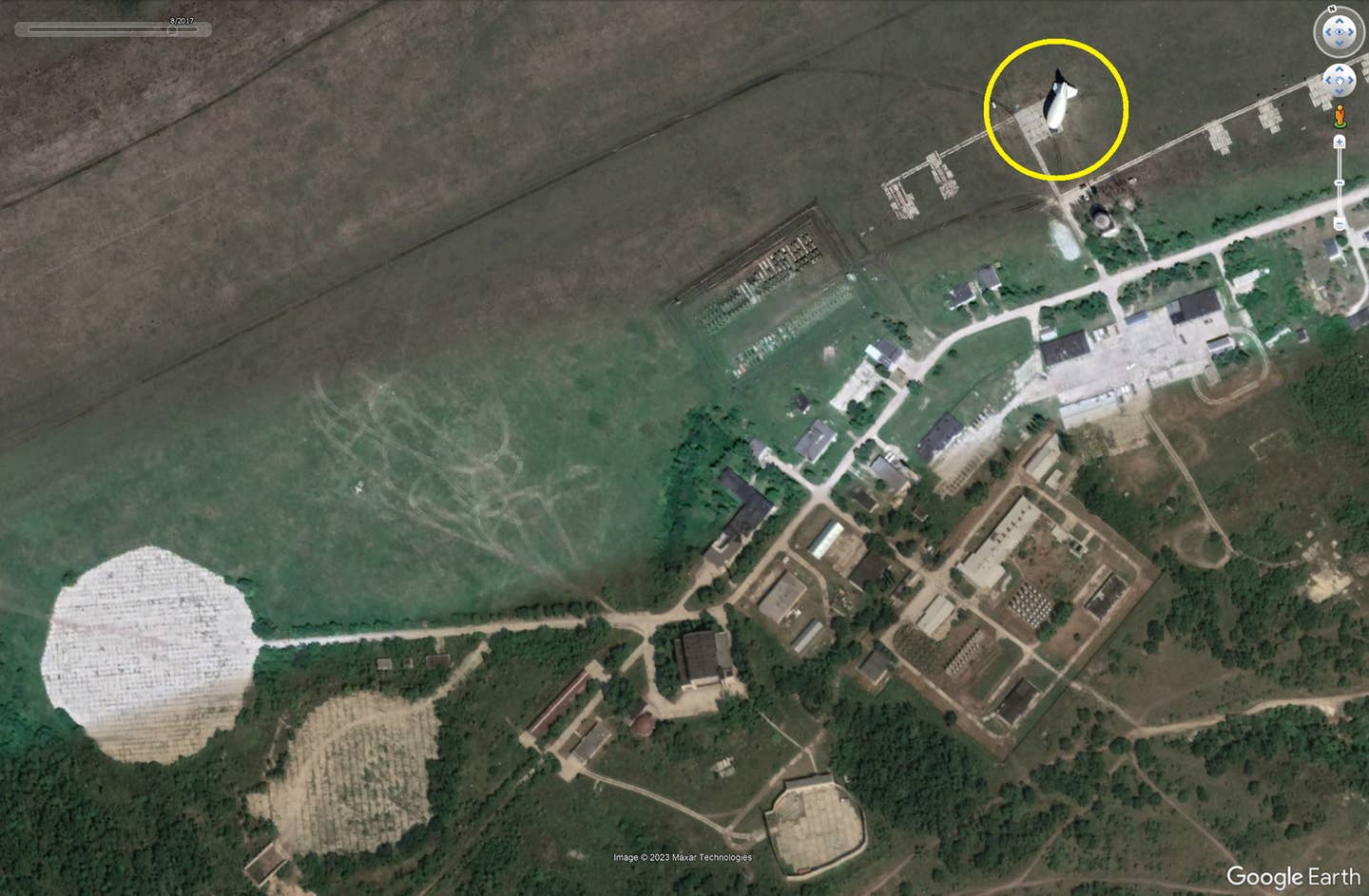 A satellite image of the military aeronautical test center in Volsk in August 2017, with an Augur Tigr, a smaller kind of tethered aerostat, being tested there. <em>Google Earth</em>