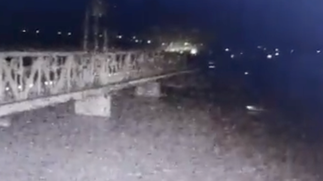 The white object in this screencap is purported to be a Russian unmanned surface vessel used to attack this rail bridge in Odesa. (Twitter screencap)