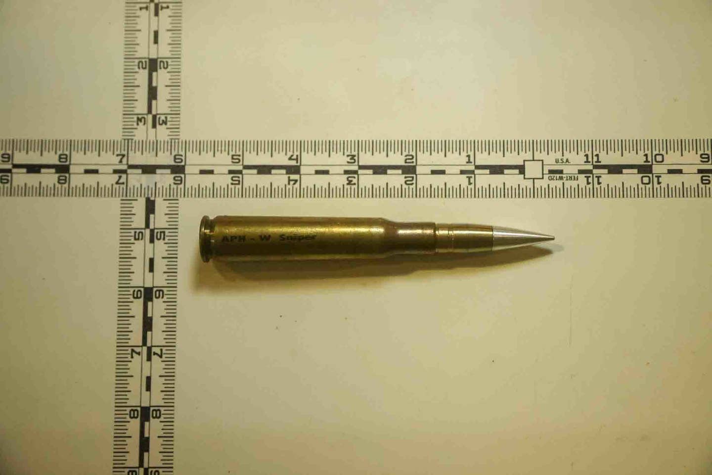 Photo taken Dec. 3, 2022 of an individual round of 12.7mm ammunition seized from a fishing trawler interdicted by Expeditionary Mobile Base USNS<em> Lewis B. "Chesty" Puller</em>, Dec. 1, in the Gulf of Oman. (U.S. Navy photo)