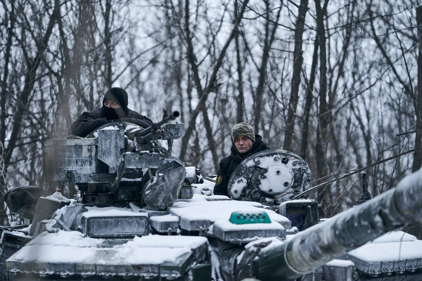 A Ukrainian tank rides to its position in the frontline in Bakhmut, Donetsk region, Ukraine, Sunday, Feb. 12, 2023. (AP Photo/Libkos)