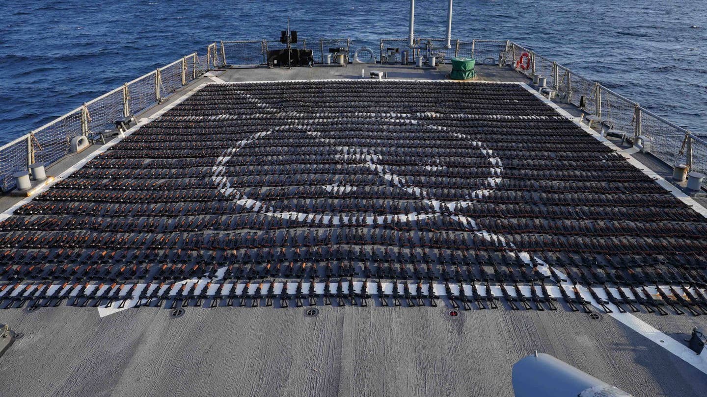 Guns that had been headed to Yemen from Iran that were captured during a counter-smuggling operation in the Gulf of Oman on January 6, 2023, are displayed on the stern flight deck of the U.S. Navy's&nbsp;<em>Arleigh Burke</em>&nbsp;class destroyer USS&nbsp;<em>The Sullivans</em>.&nbsp;<em>CENTCOM</em>