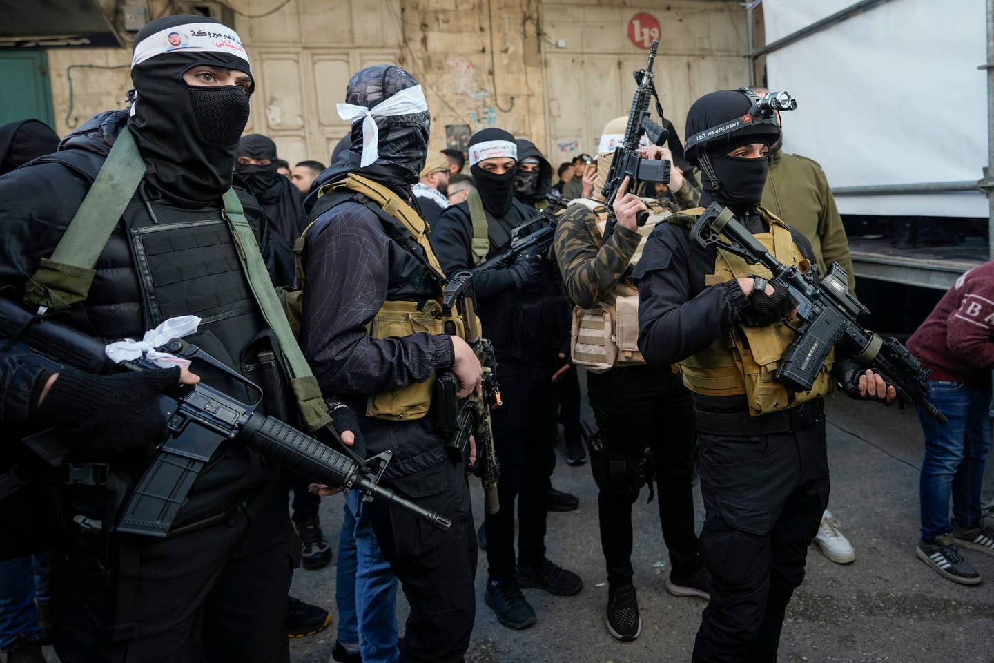 Masked Palestinian gunmen gather in solidarity with Palestinians that were killed in clashes with Israeli troops, in the West Bank city of Nablus, Friday, Feb. 10, 2023. <em>Credit: AP Photo/Majdi Mohammed</em>