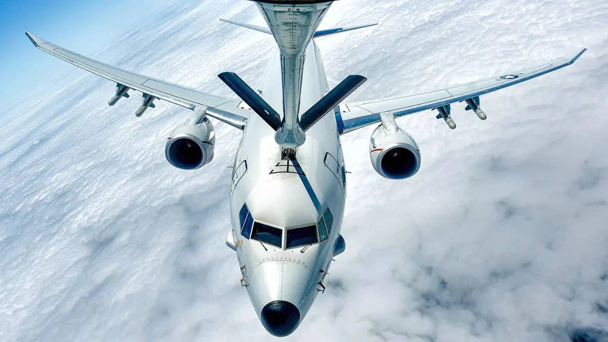 A P-8A carrying four Harpoon missiles under its wings links up with an aerial refueling tanker. <em>USN</em>
