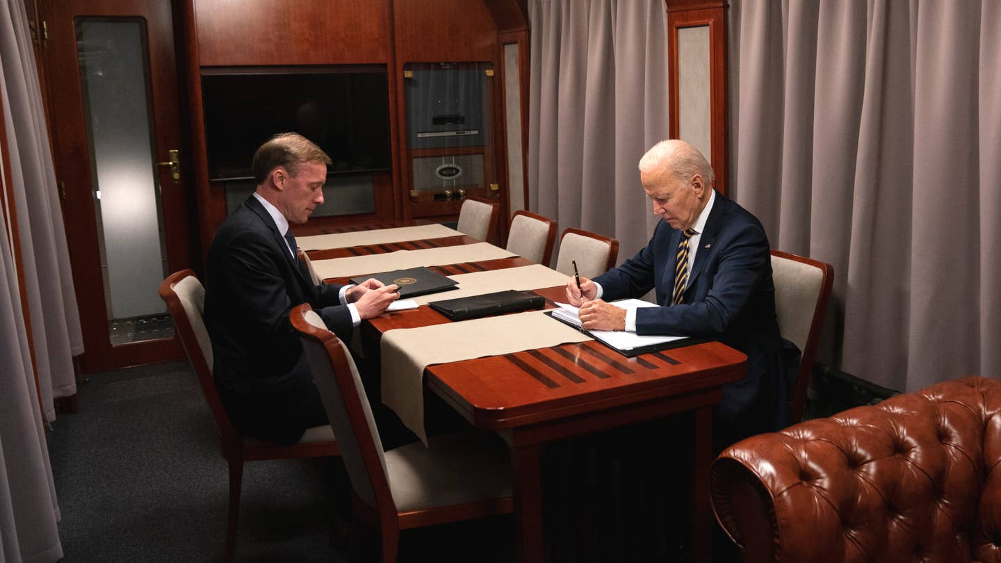 U.S. President Joe Biden, at right, and his National Security Advisor, Jake Sullivan, onboard the train to Kyiv. <em>AP Photo/ Evan Vucci</em>
