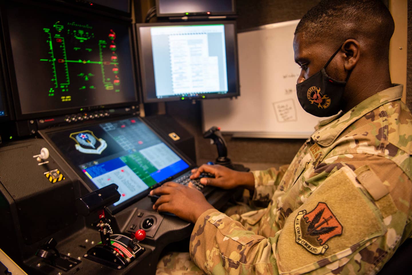 Senior Airman Derek, 432nd Aircraft Communication Maintenance Squadron Remotely Piloted Aircraft communications technician, function checks a ground control unit used to fly the MQ-9 Reaper. <em>Credit: U.S. Air Force photo by Staff Sgt. Omari Bernard</em>