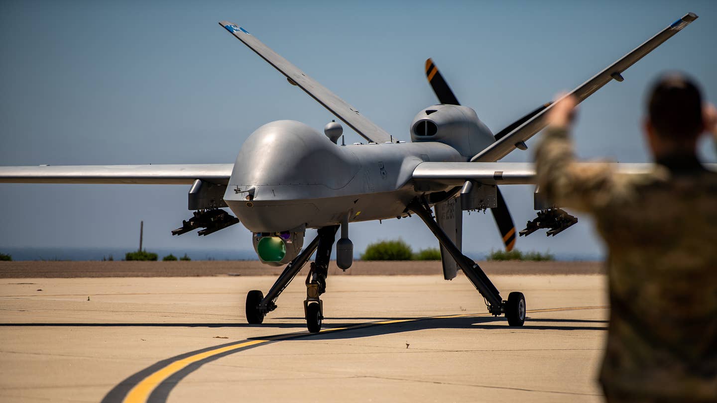 The MQ-9 Reaper Aircraft assigned to 163d Attack Wing completes autonomous landing and is taxied to maintenance position on San Clemente Island, California, on June 23. 2022. <em>Credit: Photo by U.S. Air National Guard Staff Sgt. Joseph Pagan</em>