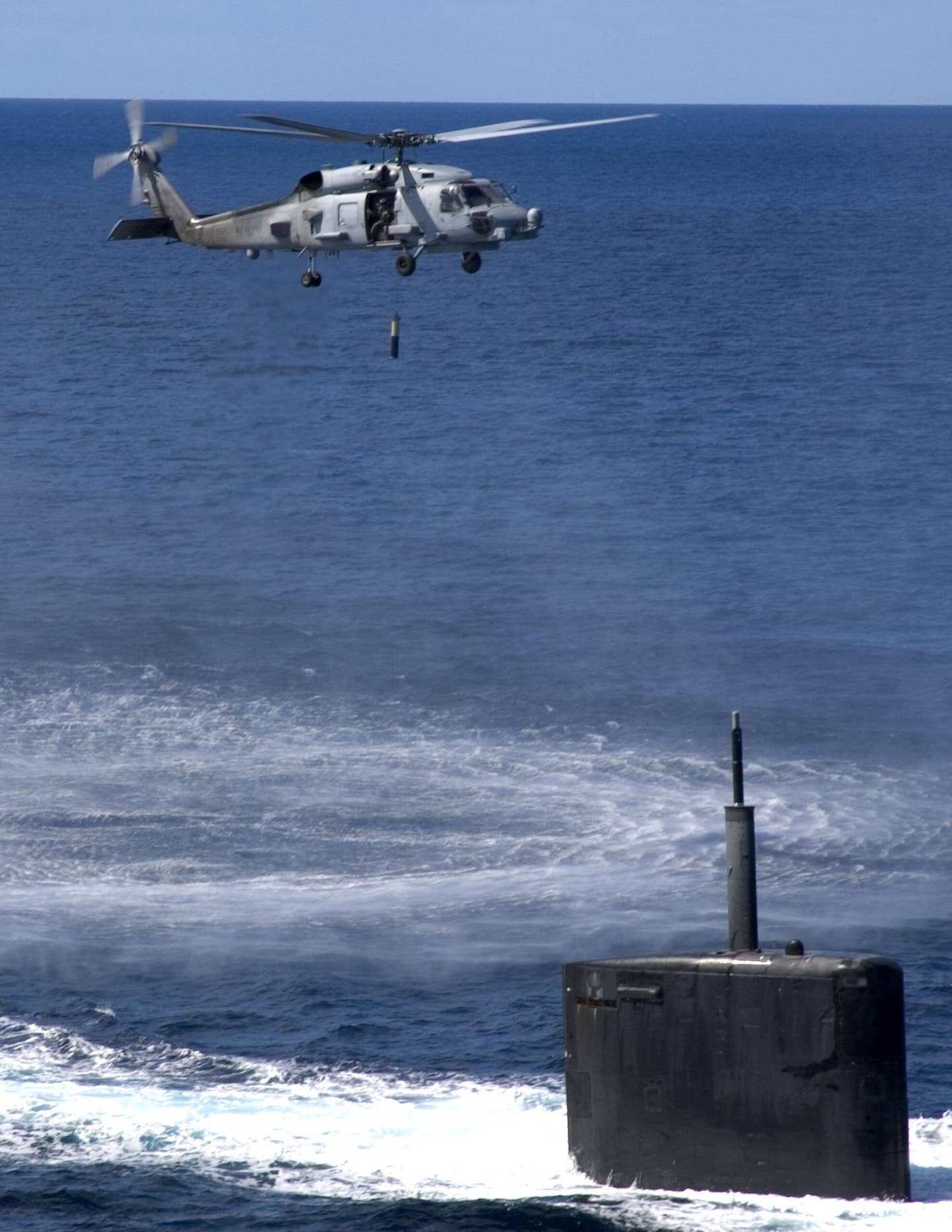 An MH-60R Seahawk, with dipping sonar, at the Atlantic Undersea Test and Evaluation Center, Bahamas, in February 2005. <em>U.S. Navy</em>