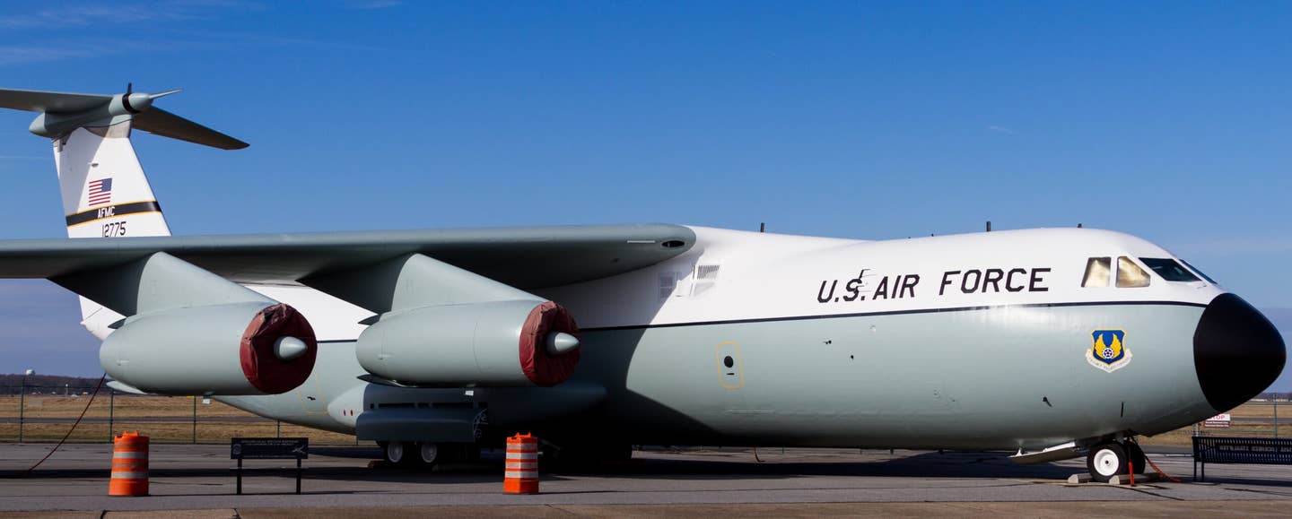 A white/gray C-141A Starlifter at the Air Mobility Command Museum at Dover Air Force Base in 2018. <em>Balon Greyjoy via Wikimedia Commons</em>