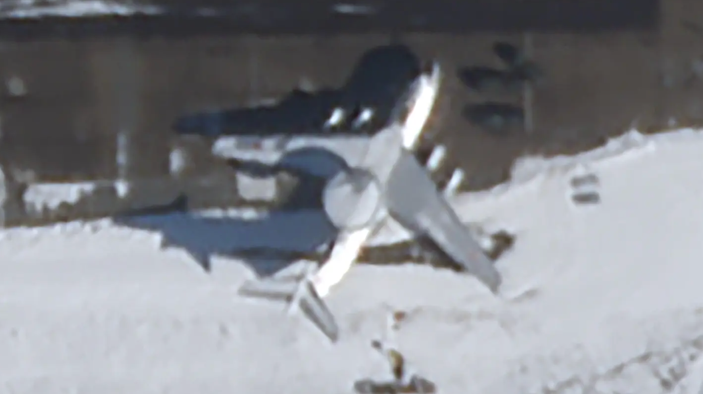 A satellite image of the A-50, from February 28. No significant damage is immediately visible, but the aircraft is surrounded by a number of large vehicles. <em>PHOTO © 2023 PLANET LABS INC. ALL RIGHTS RESERVED. REPRINTED BY PERMISSION<br></em>