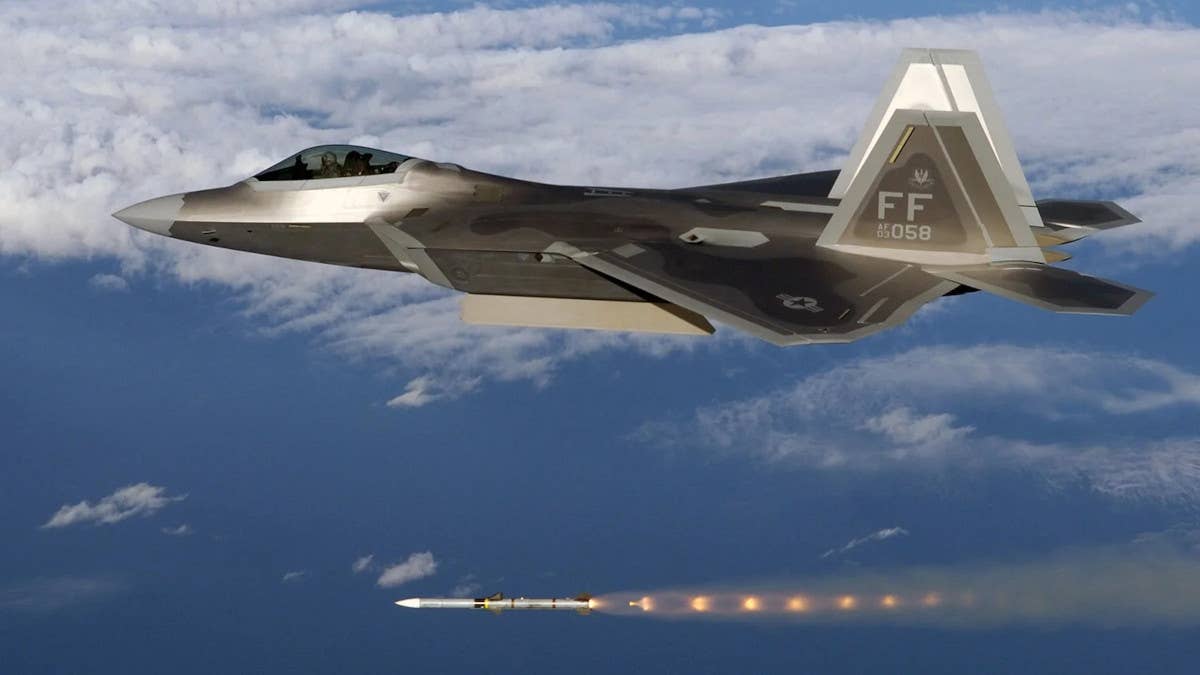 An F-22 Raptor fires an AIM-120 missile. <em>USAF</em>