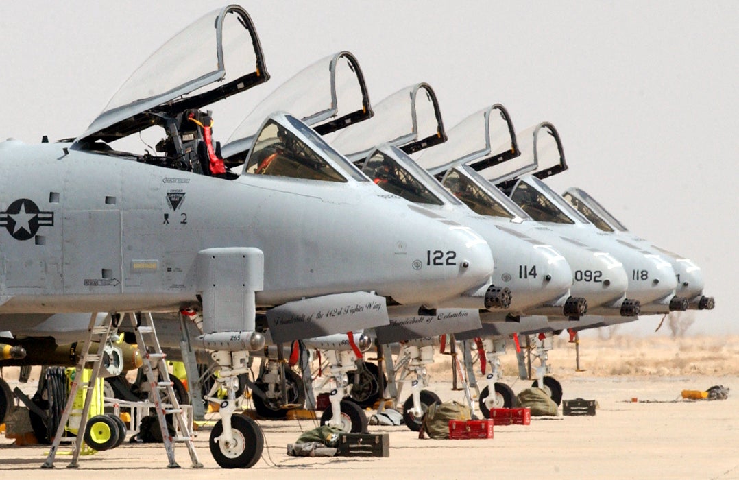 OPERATION IRAQI FREEDOM -- A-10 Thunderbolt IIs ares lined up on the flightline of Tallil Air Base in southern Iraq awaiting pilots.  The aircraft are part of the 442nd Fighter Wing from Whiteman Air Force Base, Mo., which was deployed to Talli and Kirkuk Air Bases in 2003.  (U.S. Air Force photo by Master Sgt. Terry L. Blevins)