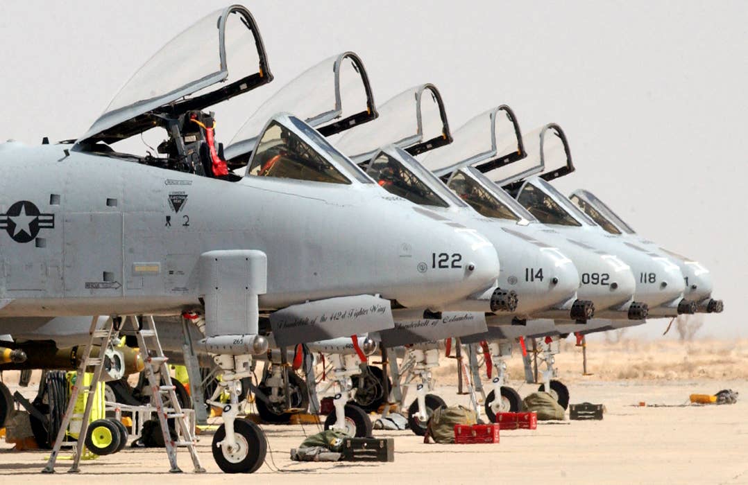 A-10s lined up on the flight line at Tallil Air Base. These jets are from the 442nd Fighter Wing from Whiteman Air Force Base, Missouri, which was deployed to Talli and Kirkuk Air Bases in 2003. <em>U.S. Air Force photo by Master Sgt. Terry L. Blevins</em>