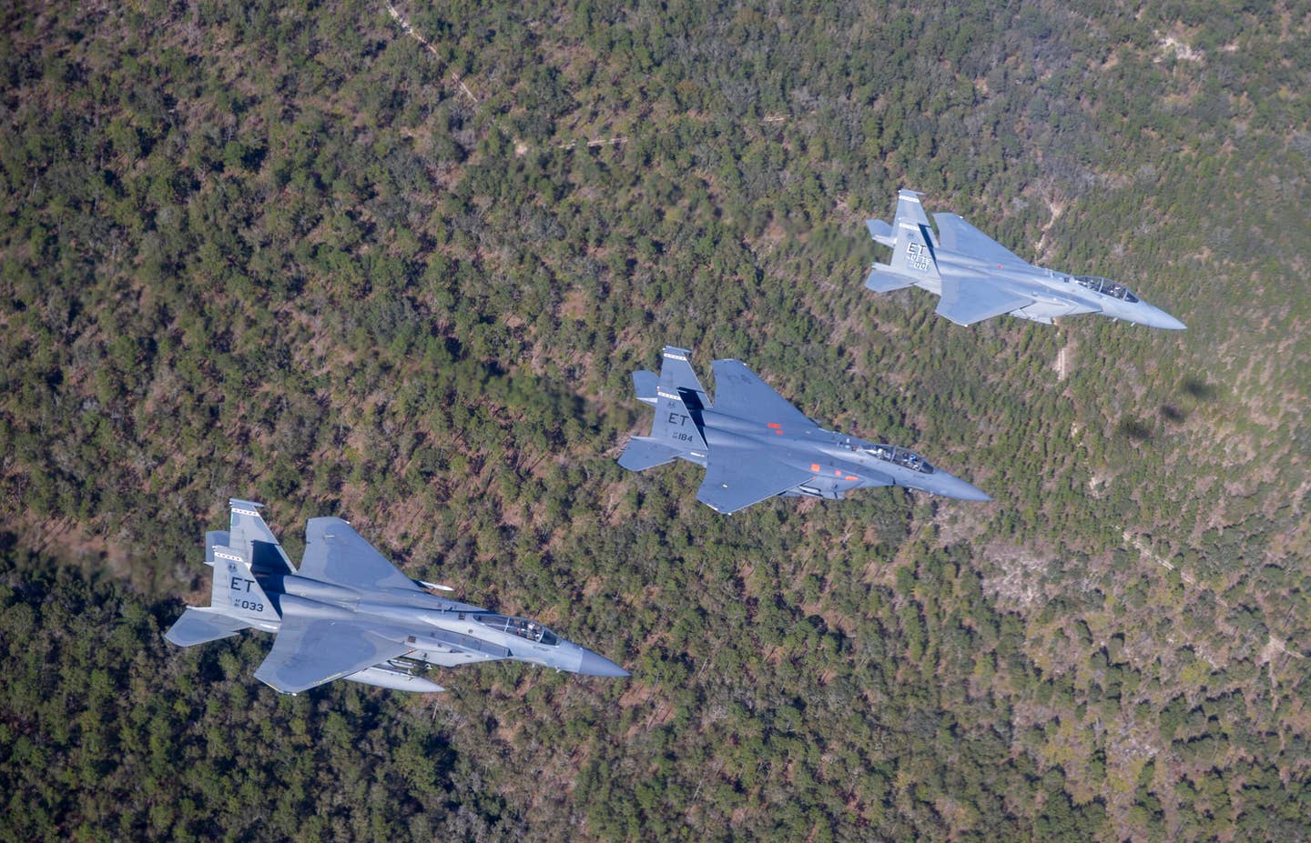 F-15EX, F-15E, F-15C in formation near Eglin AFB. (U.S. Air Force photo by Tech. Sgt. John Raven)