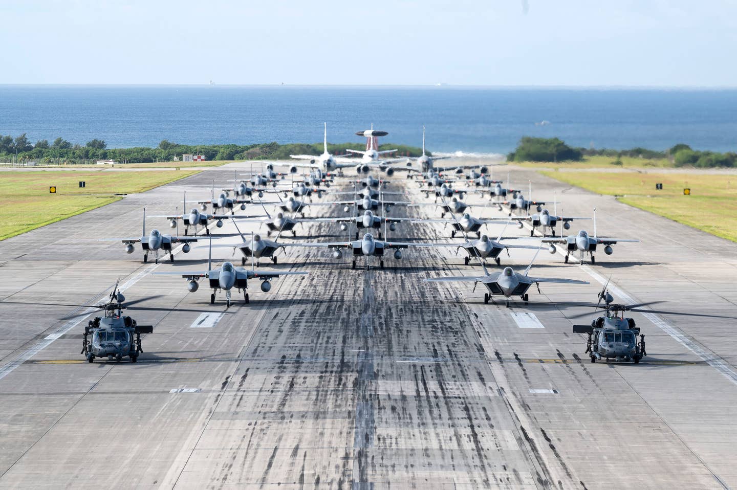 U.S. Air Force aircraft line up on the runway during a capabilities demonstration at Kadena Air Base, Japan, Nov. 22, 2022. These F-15s are all being sent to other units or retired. (U.S. Air Force photo by Senior Airman Jessi Roth)