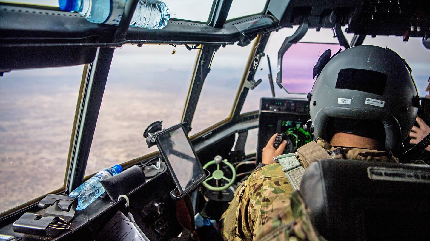 A U.S. Air Force C-130J Super Hercules pilot from the 774th Expeditionary Airlift Squadron flies a mission over Afghanistan to transport passengers and supplies to various bases throughout the country, Feb. 6, 2018. <em>Credit: U.S. Air Force photo by SSgt Douglas Ellis</em>
