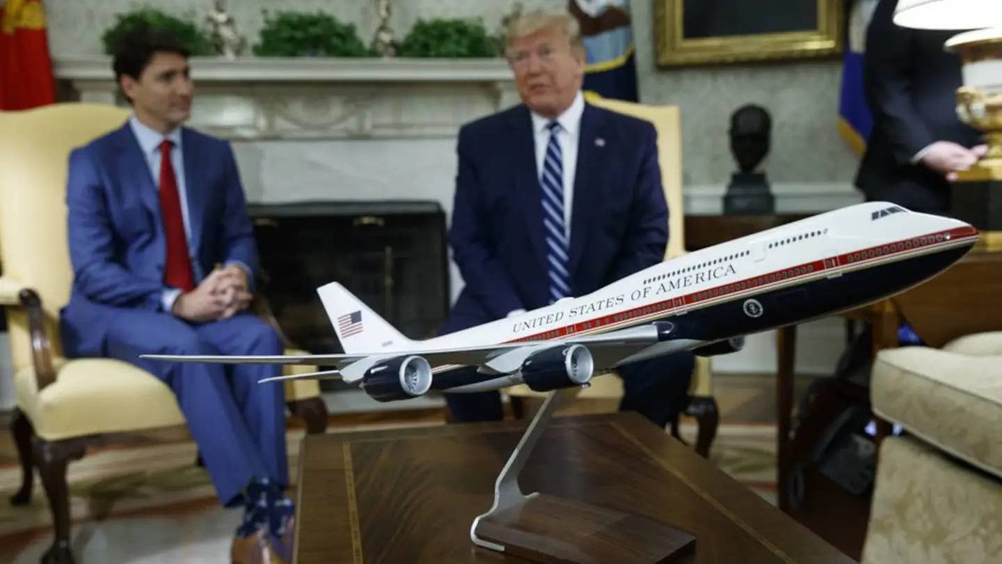 A model of a future VC-25B Air Force One aircraft sits on a table in the White House during a visit by Canadian Prime Minister Justin Trudeau to meet with then-President Donald Trump. <em>Evan Vucci/AP</em>