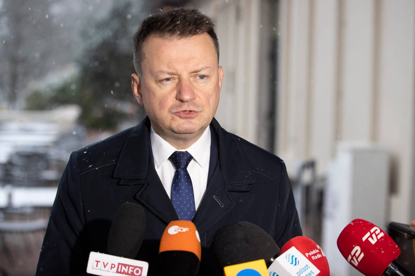 Secretary of Defense Mariusz Blaszczak of Poland gives a press briefing in January. <em>Credit: Photo by Marco Steinbrenner/DeFodi Images via Getty Images</em>