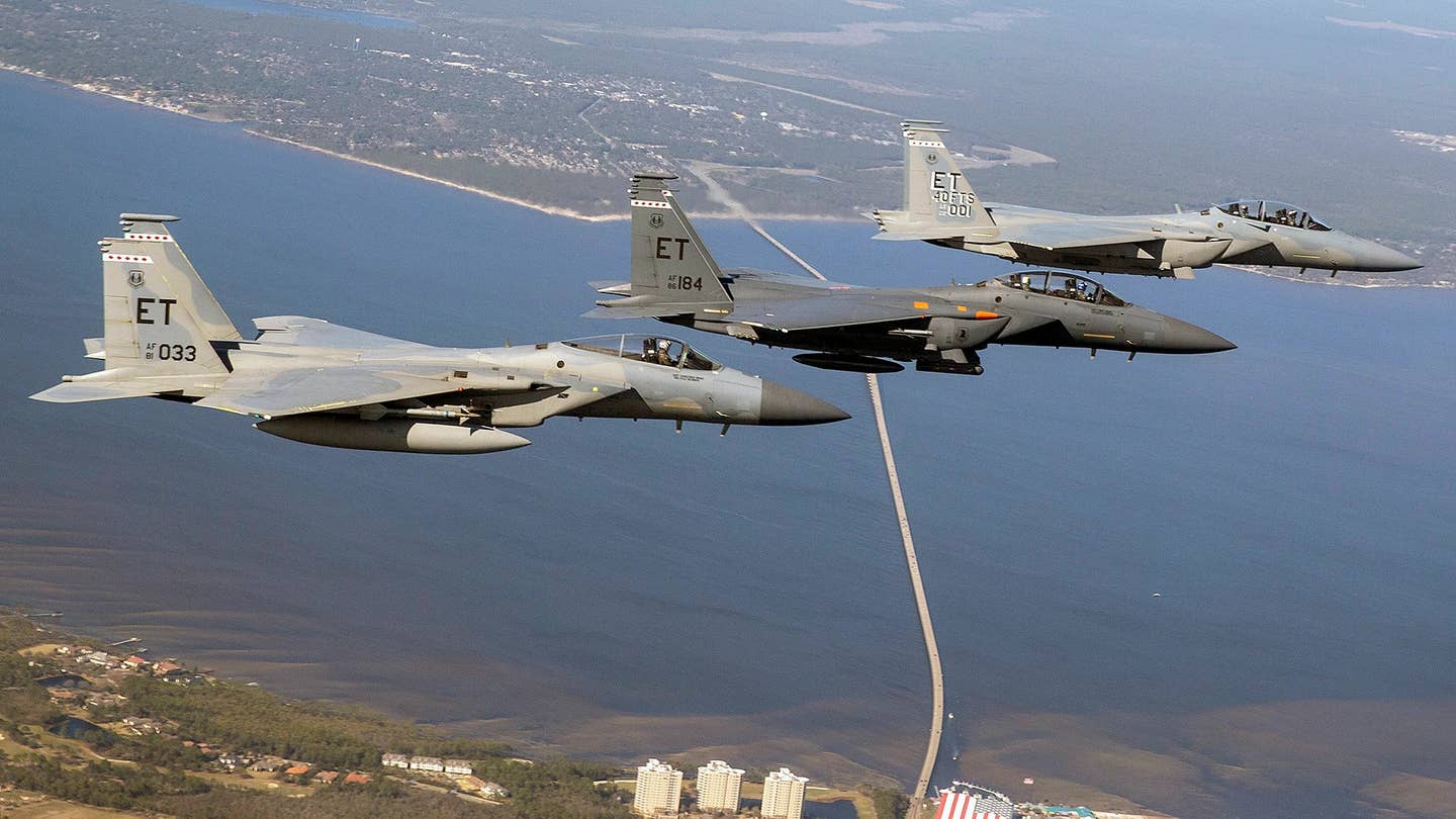From right to left, an F-15C Eagle, an F-15E Strike Eagle, and an F-15EX Eagle II. <em>USAF</em>