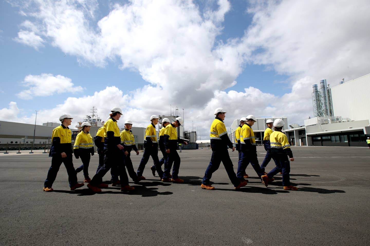 Apprentice shipbuilders walk at Osborne Naval Shipyard during a visit by then-Australian Prime Minister Scott Morrison on Sept. 26, 2020, in Adelaide, Australia. (Photo by Kelly Barnes/Getty Images)